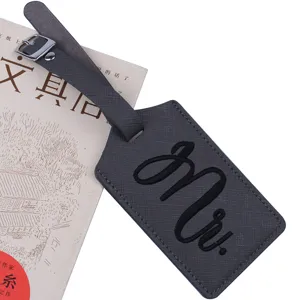 Grey PU leather luggage tag with embroidered Mr text detail, perfect for travel bags and gifts.
