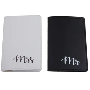 Details of black and white couple PU leather passport cover set with elegant cursive lettering.