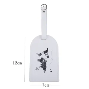 White PU leather luggage tag detail showing world map pattern and 12x7cm size dimensions.