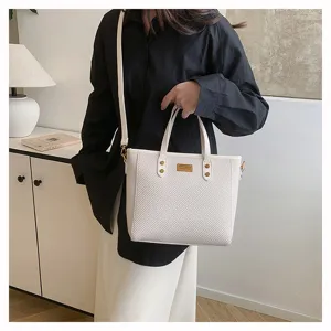 Detailed close-up view of white woven texture large capacity tote bag commuter shoulder bag.