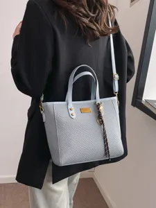 Stylish large capacity commuter tote bag for women, trendy solid color shoulder bag.