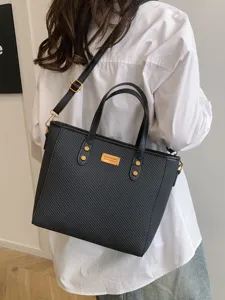 Classic black textured tote bag for women, large capacity work commuting shoulder bag.