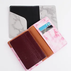 Minimalist leather passport holder with marble pattern, multi-slot travel document organizer.
