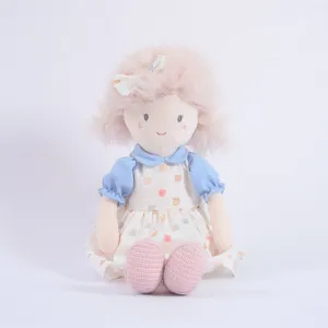 Cute plush rag doll with fluffy pink hair and blue dress, perfect for kids comforting toy.
