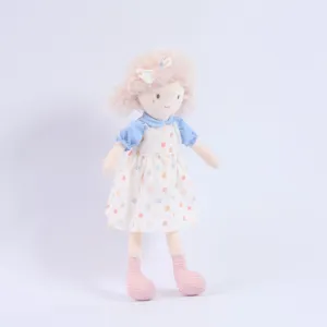 Girl plush doll toy product detail view, soft cute stuffed character toy with dress and pink hair.