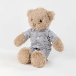 Cute brown plush teddy bear toy wearing grey dotted pajamas cozy stuffed doll gift for kids