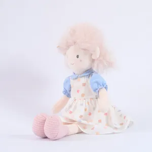 Cute plush girl doll with pink hair, blue top and patterned dress, soft soothing toy for kids.