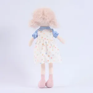 Cute plush girl doll with curly pink hair and colorful print dress for kids birthday gift.