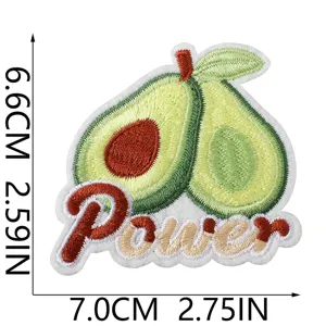 Avocado embroidery patch detail, close-up of cute fruit badge with power lettering.