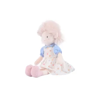 Cute plush rag doll girl with pink hair and floral dress, soft stuffed toy for kids gift.