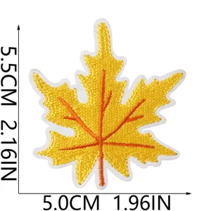 Detailed close-up of yellow maple leaf embroidered patch showing fine stitching and size.