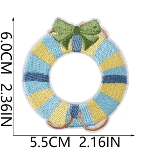 Embroidery patch detail shot, blue and yellow striped circular bow design for DIY decor.