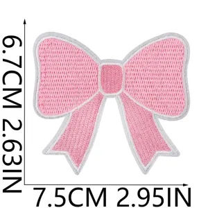 Pink embroidered bow patch detail view, perfect for DIY clothing and backpack decoration.