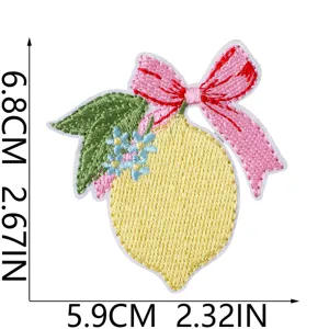 Embroidery patch detail featuring a lemon and pink bow, perfect for DIY denim jackets.
