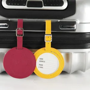 Étiquettes de bagage rondes en cuir PU avec sangle réglable et emplacement pour carte nom.