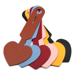 Heart-shaped PU leather luggage tags set, durable travel bag labels in assorted vibrant colors.