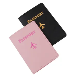 PU leather passport cover holder with embroidered airplane design and text detail view