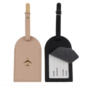 Set di etichette per bagagli in pelle con logo aereo in metallo e patta per privacy.