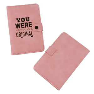 Pink PU leather passport holder detail view, showcasing the front text and back craftsmanship.