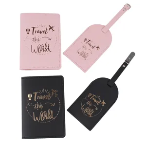 Detail view of the PU leather passport holder and luggage tag set in pink and black colors.