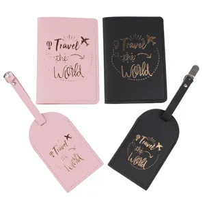 PU leather travel set of 4 including passport holders and luggage tags in pink and black.