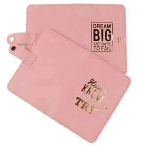 Pink PU leather travel passport holder with gold foil motivational text and snap button closure.