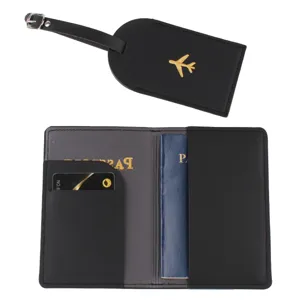 Black PU leather passport holder and luggage tag set with gold airplane embroidery details.