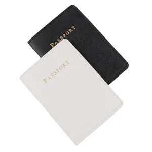Detailed view of minimalist black and white PU leather passport holders for travel organization.