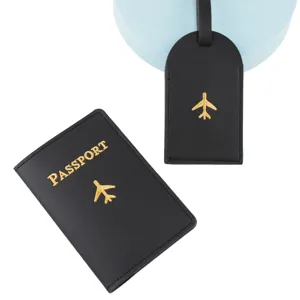 Detailed shot of black PU leather passport holder and luggage tag with gold embroidery.