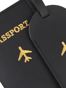 Black PU leather passport holder and luggage tag set with gold embroidered airplane motif.