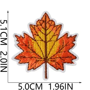 Detailed view of embroidered maple leaf patch for DIY clothing repair and decorative use.