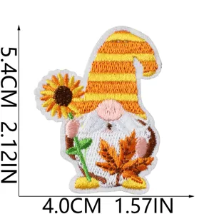 Cute autumn gnome embroidery patch with sunflower and maple leaf, perfect for DIY clothing repair.