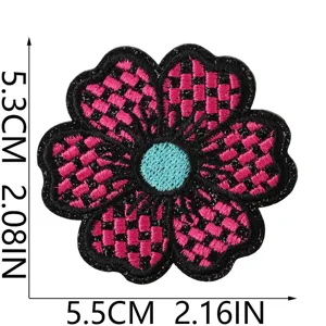 Close-up detail of the pink and black checkered embroidered flower patch with blue center, 5.3x5.5cm size.