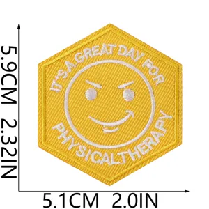 Yellow hexagonal embroidered patch with smiley face and inspirational text for clothing.