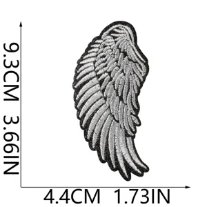 Embroidered angel wing patch detail, black and white leather fabric DIY accessory.