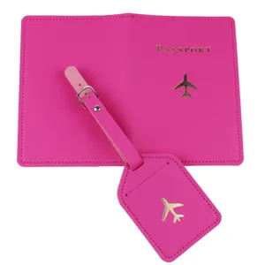 Hot pink passport cover and luggage tag set with gold airplane motif and passport text.