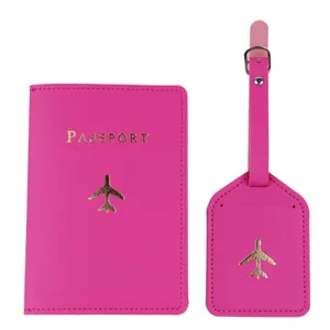 Hot pink leather passport cover and luggage tag set with gold foil airplane pattern.