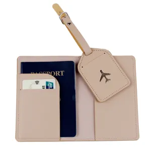 Detailed view of blush pink leather passport holder and matching luggage tag set, travel accessory.
