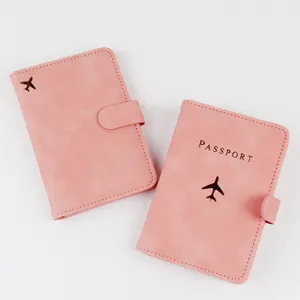 Pink RFID passport holder travel card organizer with cute airplane logo and secure magnetic closure.