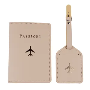 Close-up of beige passport cover and luggage tag set with airplane pattern and passport text.