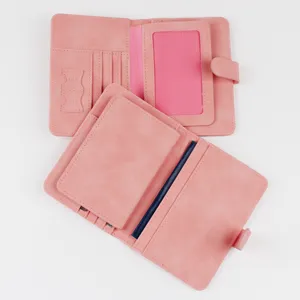 Detailed view of the pink travel passport holder showing internal card slots and SIM pocket.