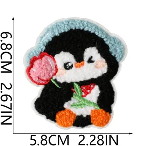 Cute penguin embroidered patch with blue hat and flower, soft texture iron-on badge for kids.