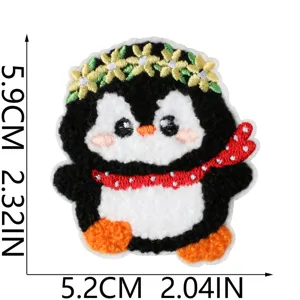 Cute cartoon penguin embroidered patch with flower crown and red scarf for clothing decor.
