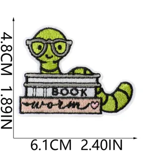 Cute bookworm embroidered patch detail showing neat stitching, glasses and stack of books.