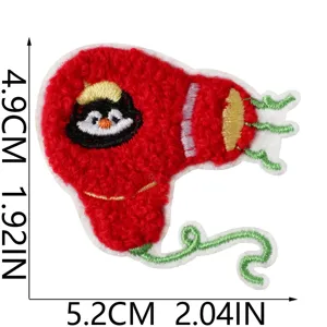 Cute plush hair dryer patch, embroidered cartoon penguin design for clothing and luggage decor.