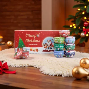 Christmas scented candle tin jar gift set with colorful patterned metal containers and holiday box.