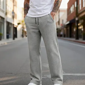 Vista di dettaglio dei pantaloni casual grigi in maglia waffle da uomo, taglio dritto con coulisse.