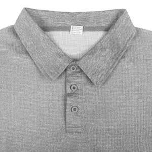 Grey waffle knit polo shirt collar and button placket detail close up view for men.