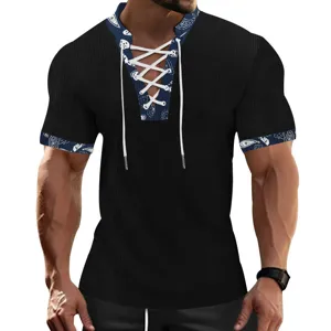 Close-up detail of men's black ribbed short sleeve T-shirt featuring V-neck lace-up and printed trim.