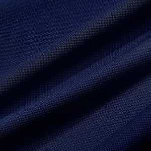 Close-up detail of navy blue quick-dry fabric, breathable polo shirt material texture.
